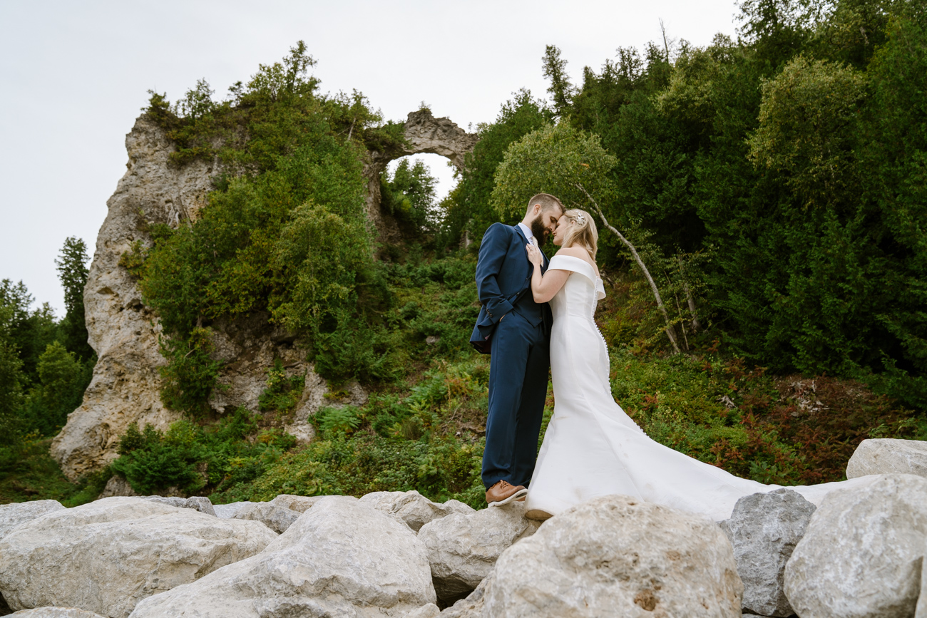 Elopement couple in front of scenery on Mackinac Island