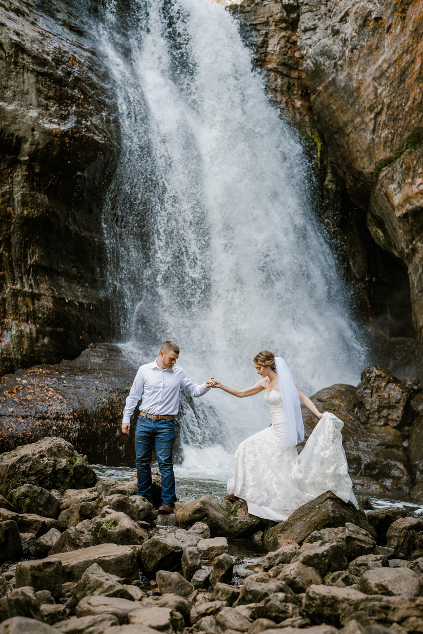Couple in front of waterfall in the Upper Peninsula