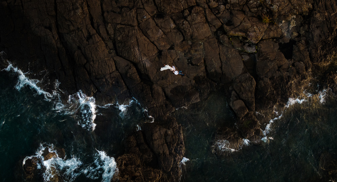 Drone photo of elopement couple at Black Rocks on Lake Superior